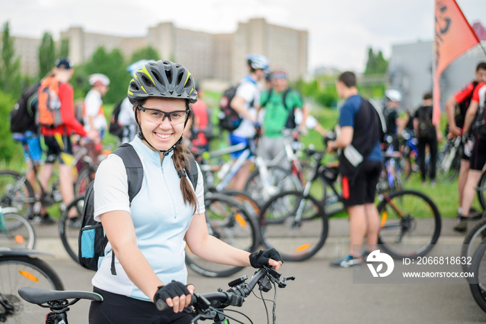 woman with bicycle at bicycle parade