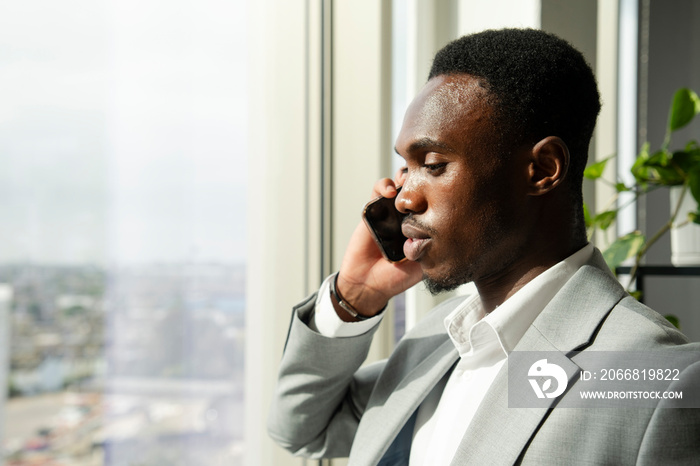 Young businessman using smart phone