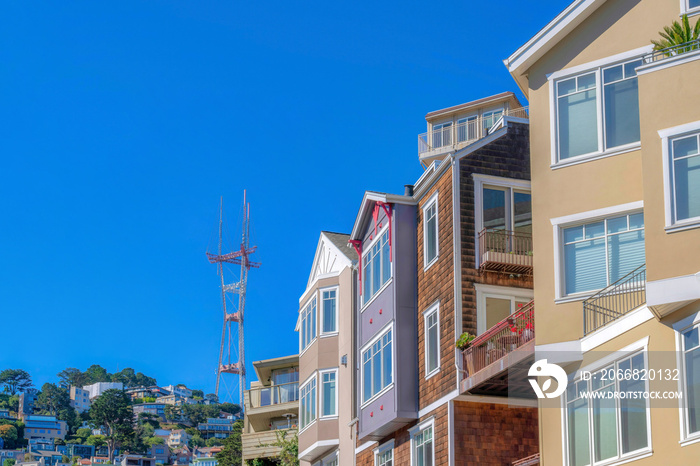 Row of four-storey houses with a view of neighborhood on a mountain slope near the Sutro Tower