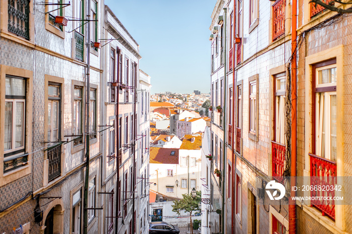 Beautiful street view with beautiful residential buildings in Mouraria district during the morning light in Lisbon city, Portugal