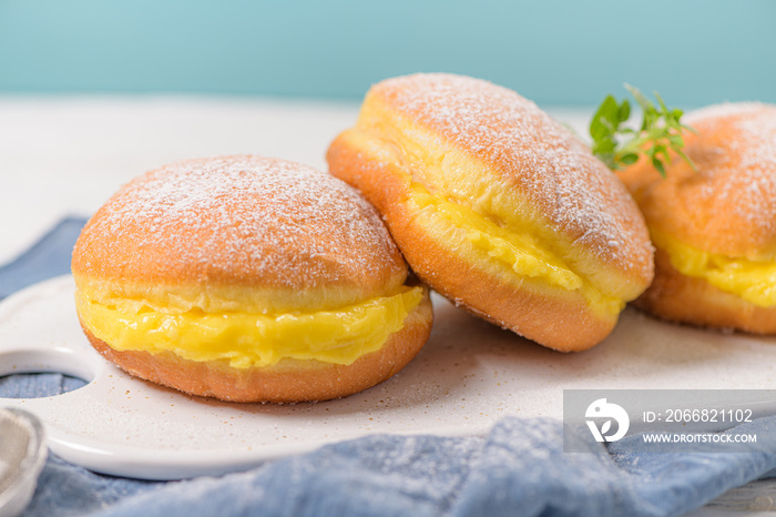 Bolas de Berlim, or  Berlin Balls . Portuguese fried dough with sugar, Filled with sweet egg cream.