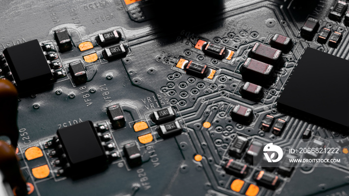 Close up of components and microchips on PC circuit board.