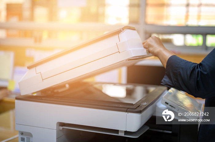 Office staff photocopying at the document maker