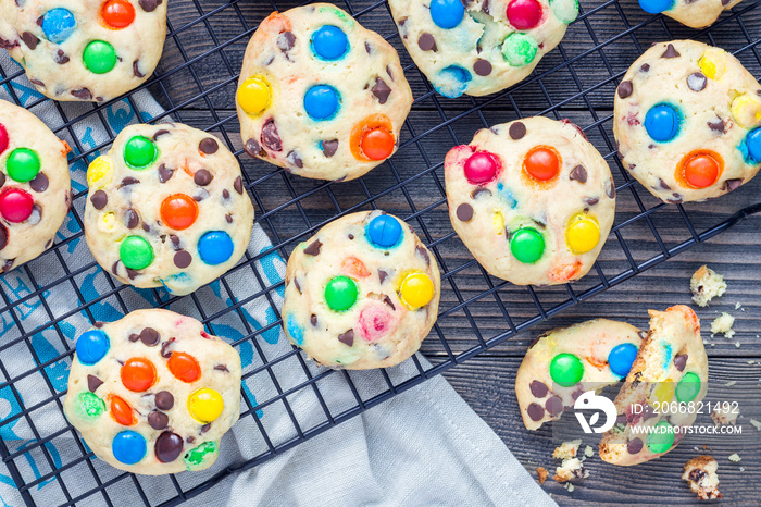 Shortbread cookies with multi-colored candy and chocolate chips on cooling rack, horizontal, top view