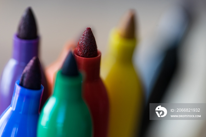 Colorful Sharpie pen tips close up in a basket