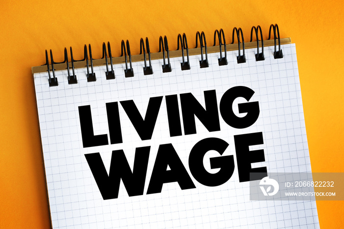 Living Wage text on notepad, concept background