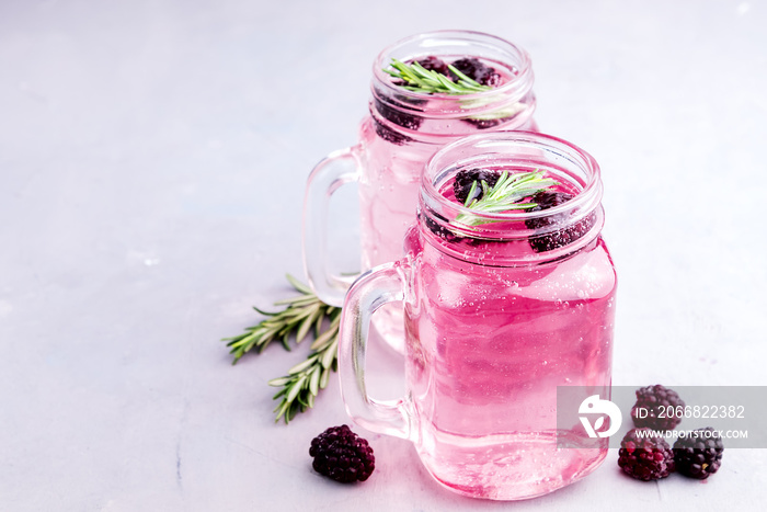 Tasty cold blackberry lemonade with rosemary