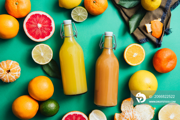 Freshly squeezed juice in glass bottles in zero waste kitchen, table top view