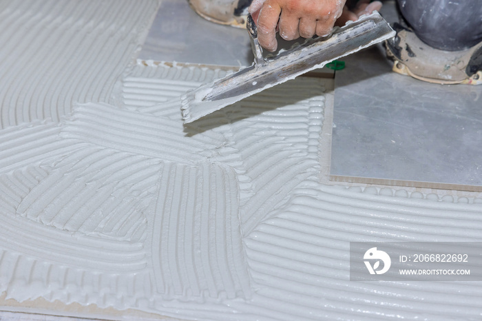 For laying tile on a concrete floor, mortar is troweled onto the floor in order to apply adhesive with reconstruction bathroom