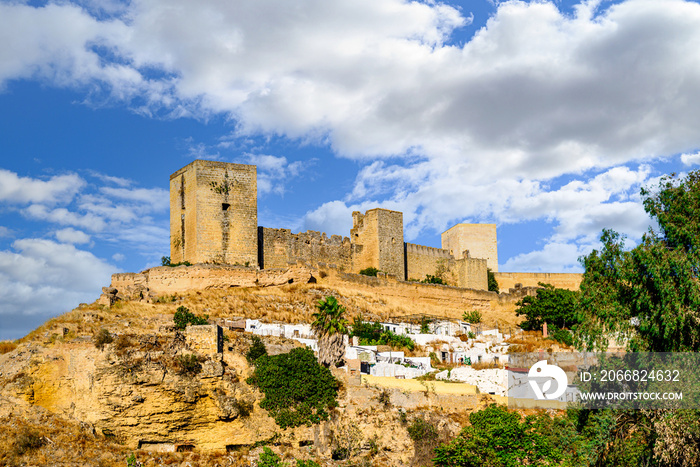 Views from the Parque de la Retama of the castle of Alcalá de Guadaira in Seville, in blue sky and white clouds