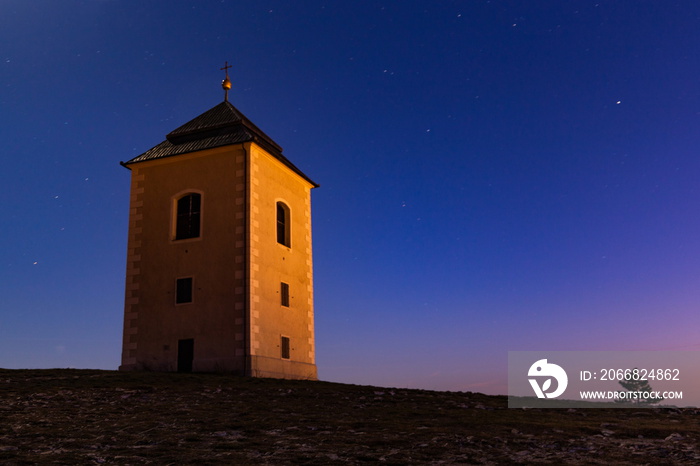 Holy Hill (Svaty Kopecek) with Saint Sebastian chapel at night. Mikulov, South Moravian region. Czech Republic.