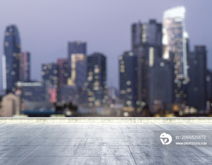 Empty concrete dirty rooftop on the background of a beautiful blurry Los Angeles city skyline at night, mock up