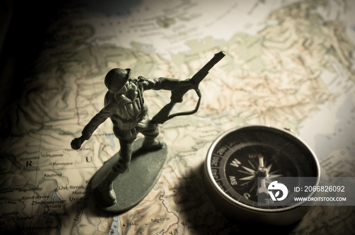 Soldier toys with compass on map