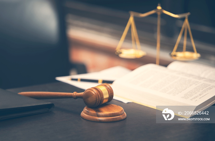 judge gavel with law book on wooden table