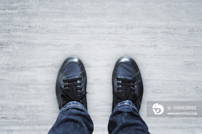 Top view of blue casual shoes on concrete floor background with copyspace