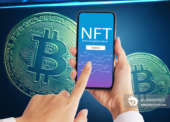 Hand holdding smartphone NFT blockchain on bitcoin cryptographic background marketplace,Cryptoart concept