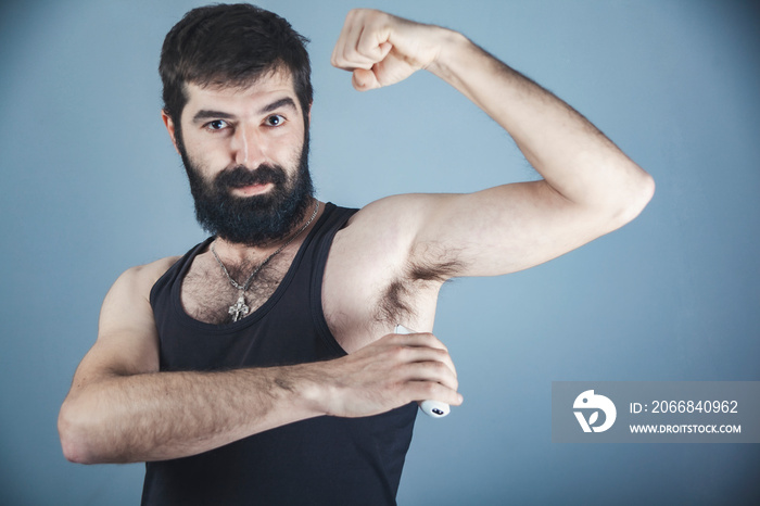 Photo of handsome man shaving his armpit,Man shaving his armpit