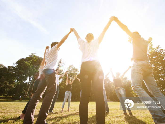 large group of friends tohether in a park having fun