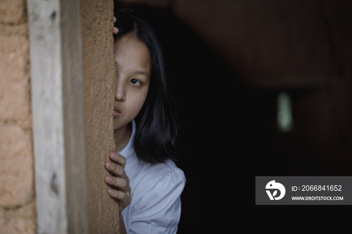 Young girl with eye sad and hopeless. Human trafficking and fear child concept.