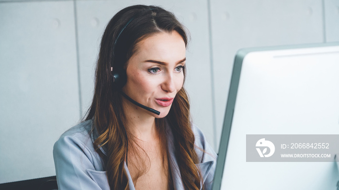 Business people wearing headset working in office to support remote customer or colleague. Call center, telemarketing, customer support agent provide service on telephone video conference call.