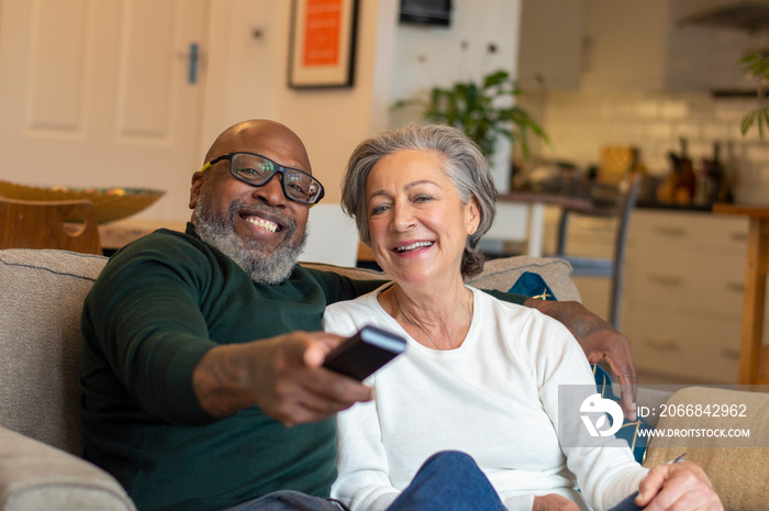 Senior couple sitting on sofa