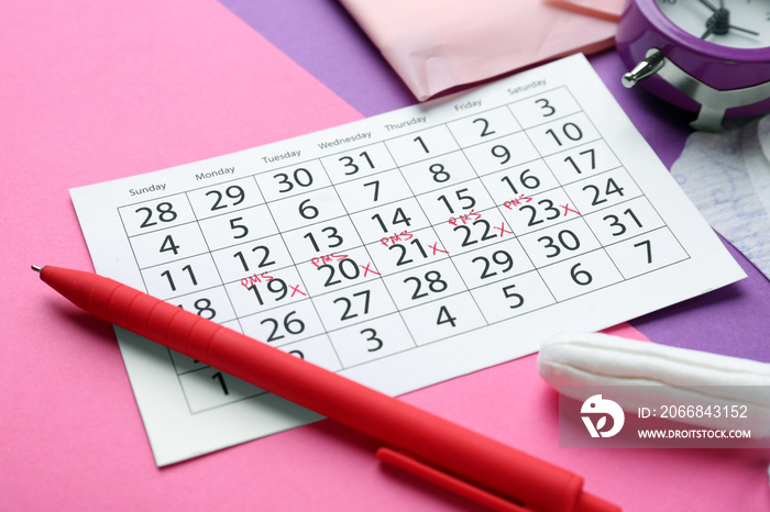 Menstrual calendar on color background