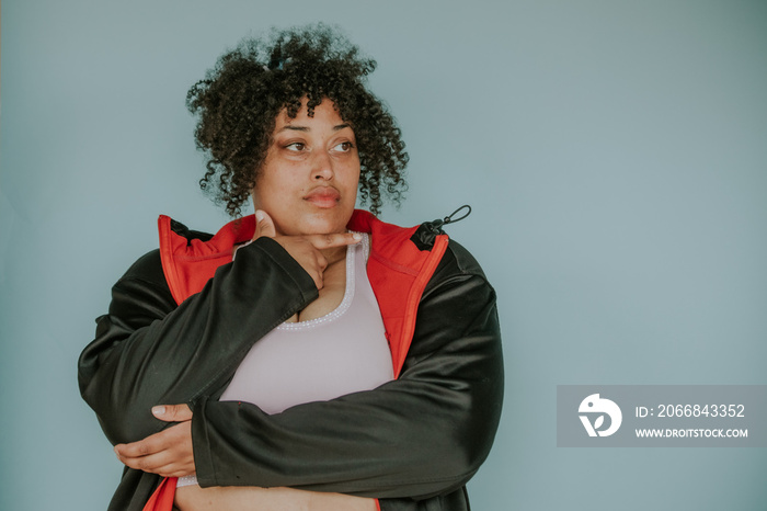 portrait of a plus size afro indigenous person looking away