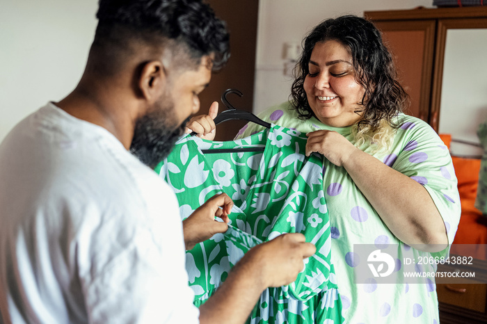 Couple choosing what to wear to start the day