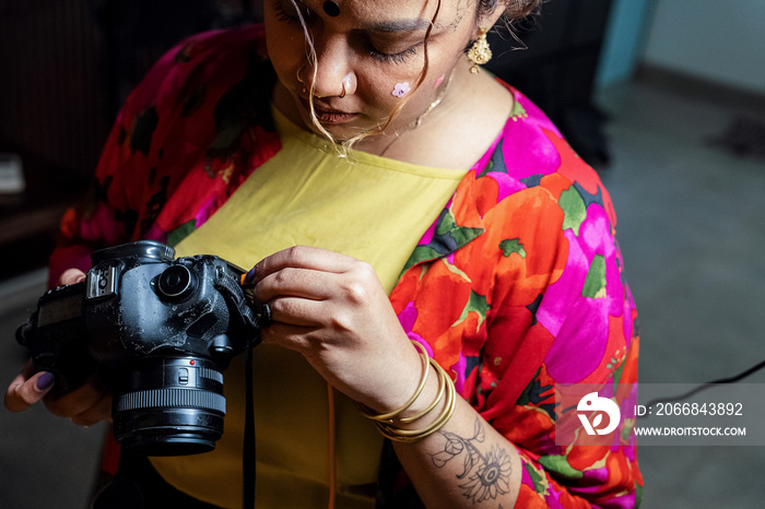 Plus sized female getting her headshots taken by a south asian female photographer