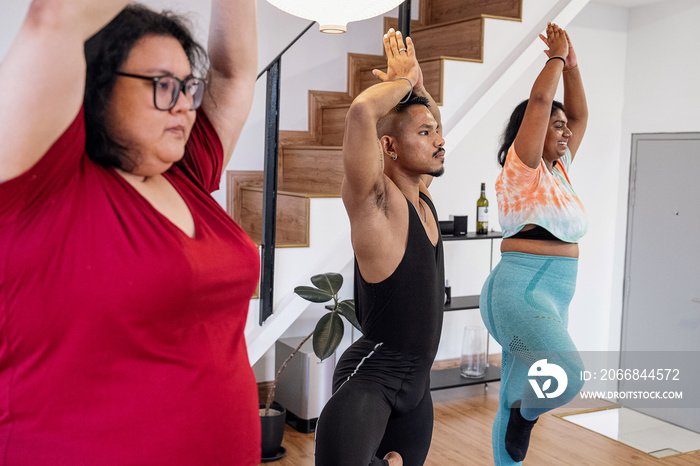 Group of friends meditating and doing yoga at home