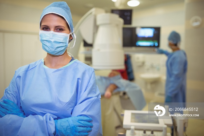 Portrait of female surgeon standing in operation theater