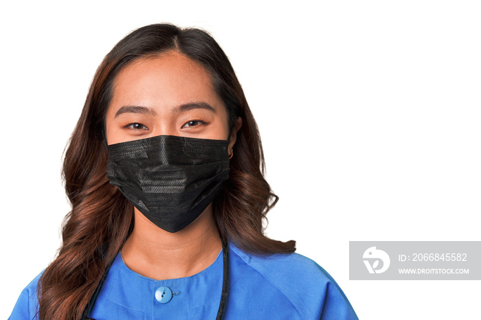 Masked young chinese female nurse.