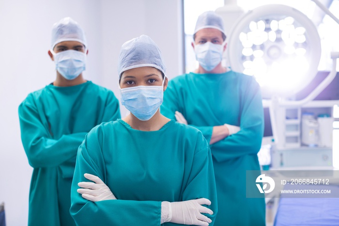 Team of surgeons wearing surgical mask in operation theater