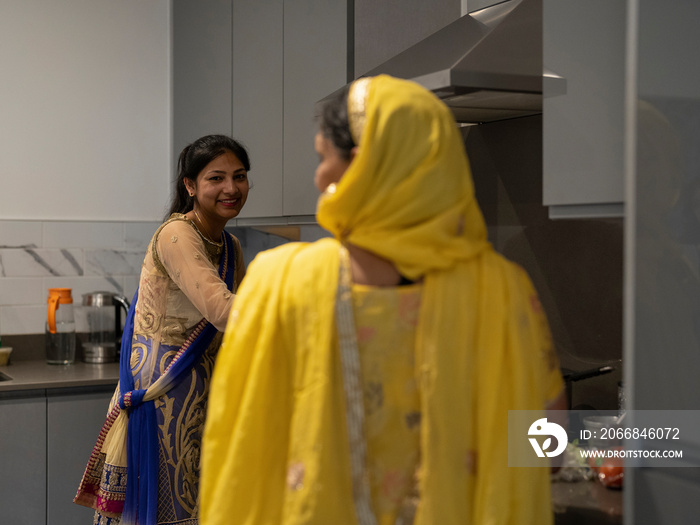 Women in traditional clothing cooking meal together