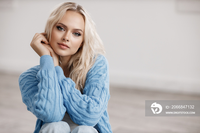 Young beautiful blond woman portrait indoor