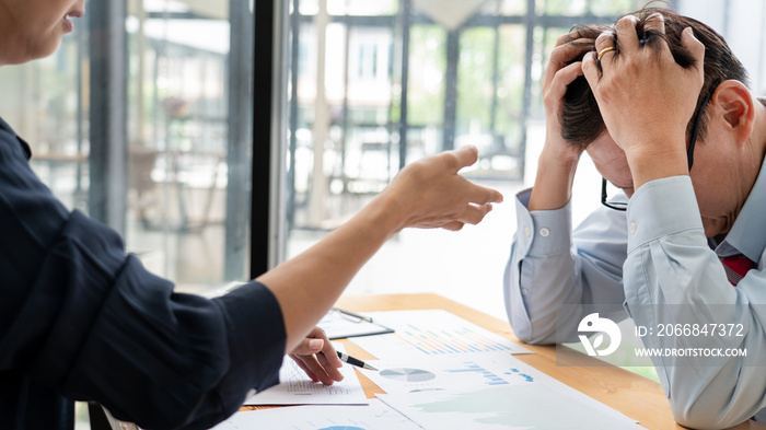 A angry female boss blaming a stressful man about errors on the recent project