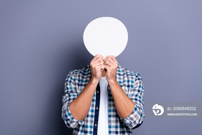 Close up photo handsome he him his guy arms hands holding round circle shape figure paper list hiding head faceless person no emotions wear casual plaid checkered shirt isolated grey background