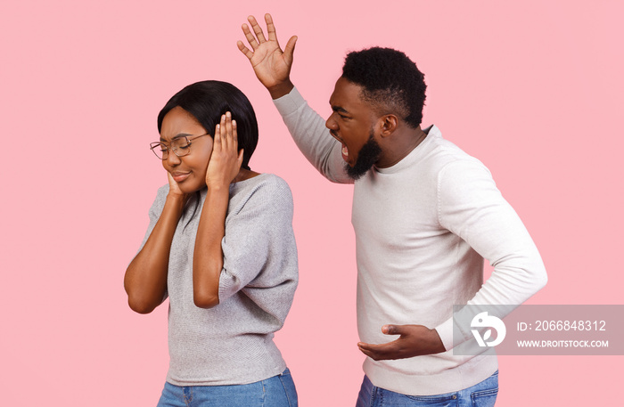 Violent black man shouting at his girlfriend