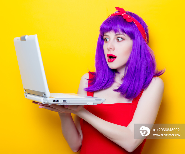 girl with purple color hair and laptop computer