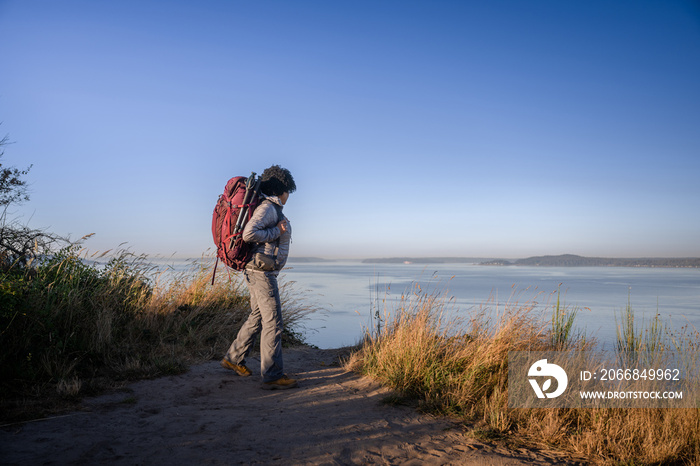 U.S. Army female soldier putting in the miles with an early morning hike in the NorthWest.