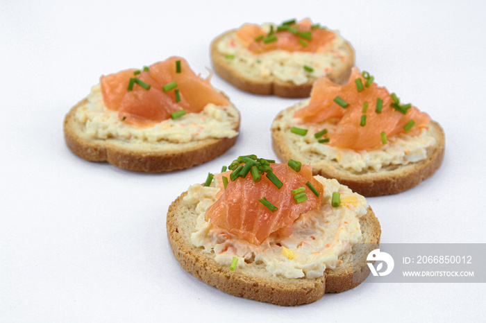 toast with smoked salmon on a white background