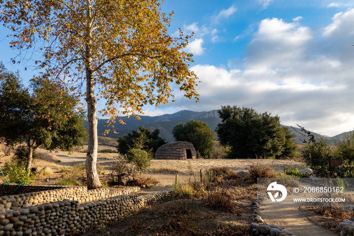 Traditional Chumash native American Indian home made of twigs surrounded by the Santa Monica Mountains California in autumn fall landscape