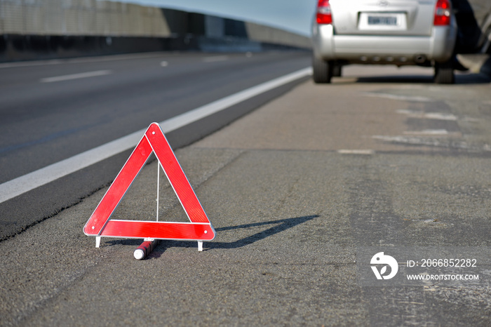 Closeup of warning triangle on roadside