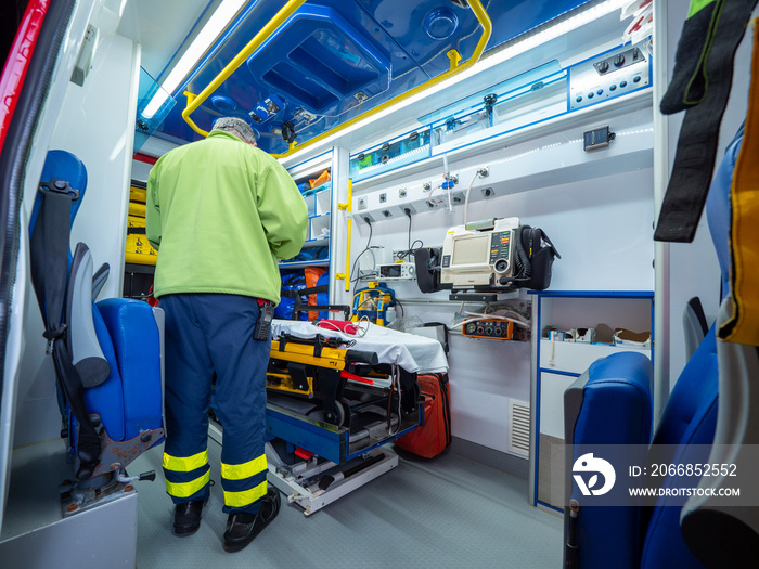 Inside an ambulance for the hospital with a nurse.