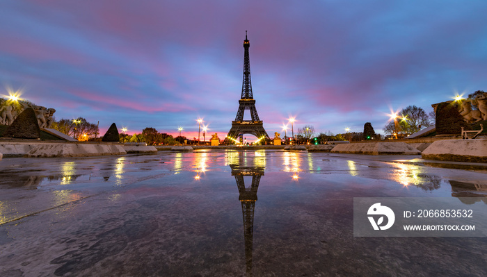 Sunrise on the Eiffel tower reflection on the Trocadero fountain water in Paris, one of the most visited building by the tourists