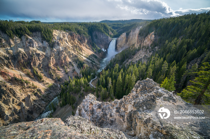 lower falls of the yellowstone national park at sunset, wyoming, usa