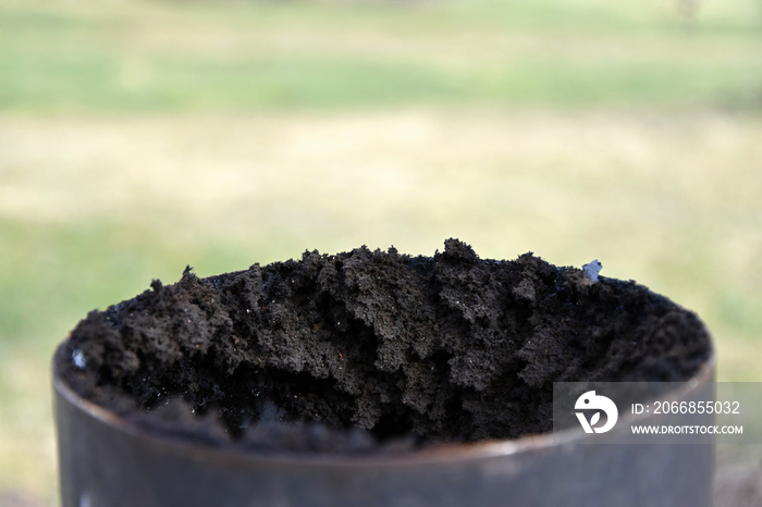 Chimney flue pipe covered with a thick layer of soot.