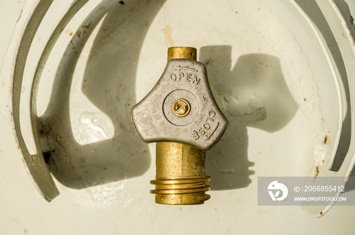 Overhead close-up of a propane tank and valve