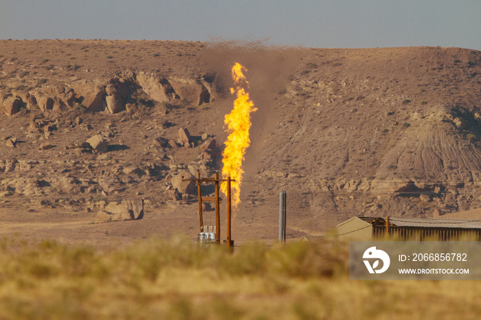 Methane burning at a flare stack in rural America adds a harmful greenhouse gas to the atmosphere