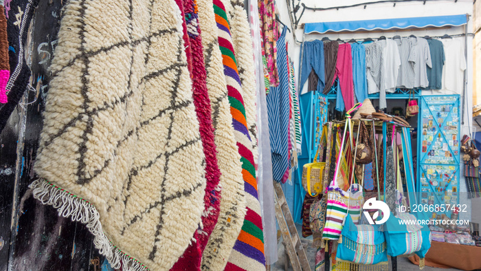 Handmade carpets, bags and clothes in a market, Medina, Chefchaouen, Blue City of Morocco.